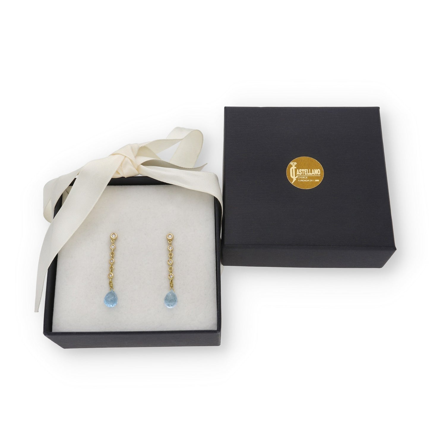 Pendientes Quadama en Oro de Ley 18K con Diamantes y Topacios Azules Facetados