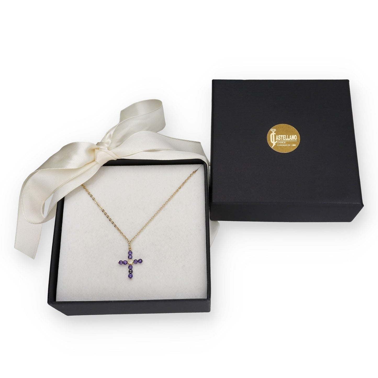 Colgante Cruz en Oro de Ley 18K con Tanzanitas y Diamante Central